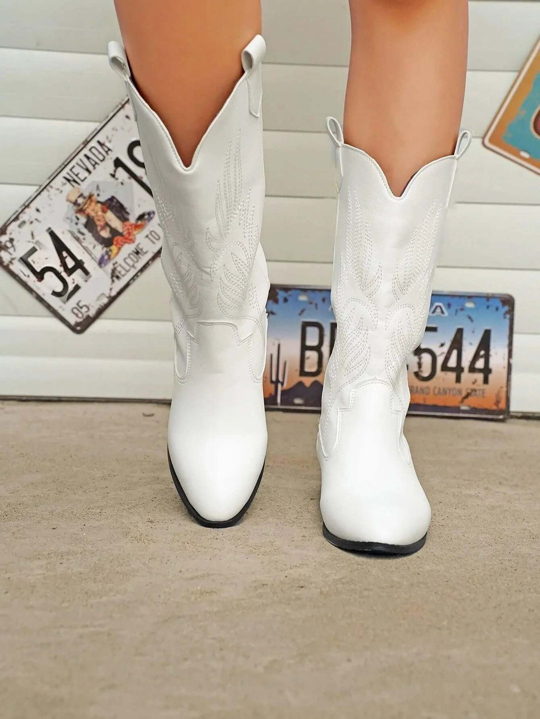 Blue women's cowboy boots, comfortable western fashion, a trendy statement piece.