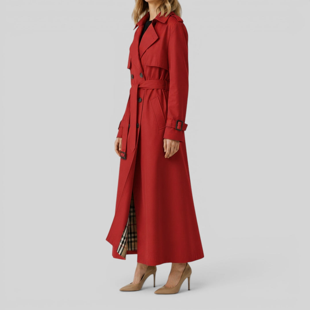 Woman wearing a sophisticated classic longline trench coat, belted for a chic fall fashion statement.