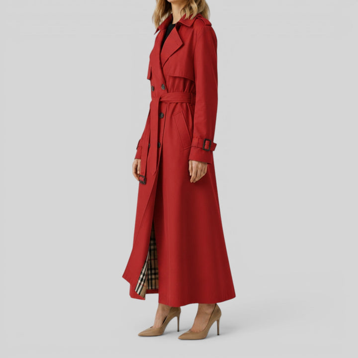 Woman wearing a sophisticated classic longline trench coat, belted for a chic fall fashion statement.