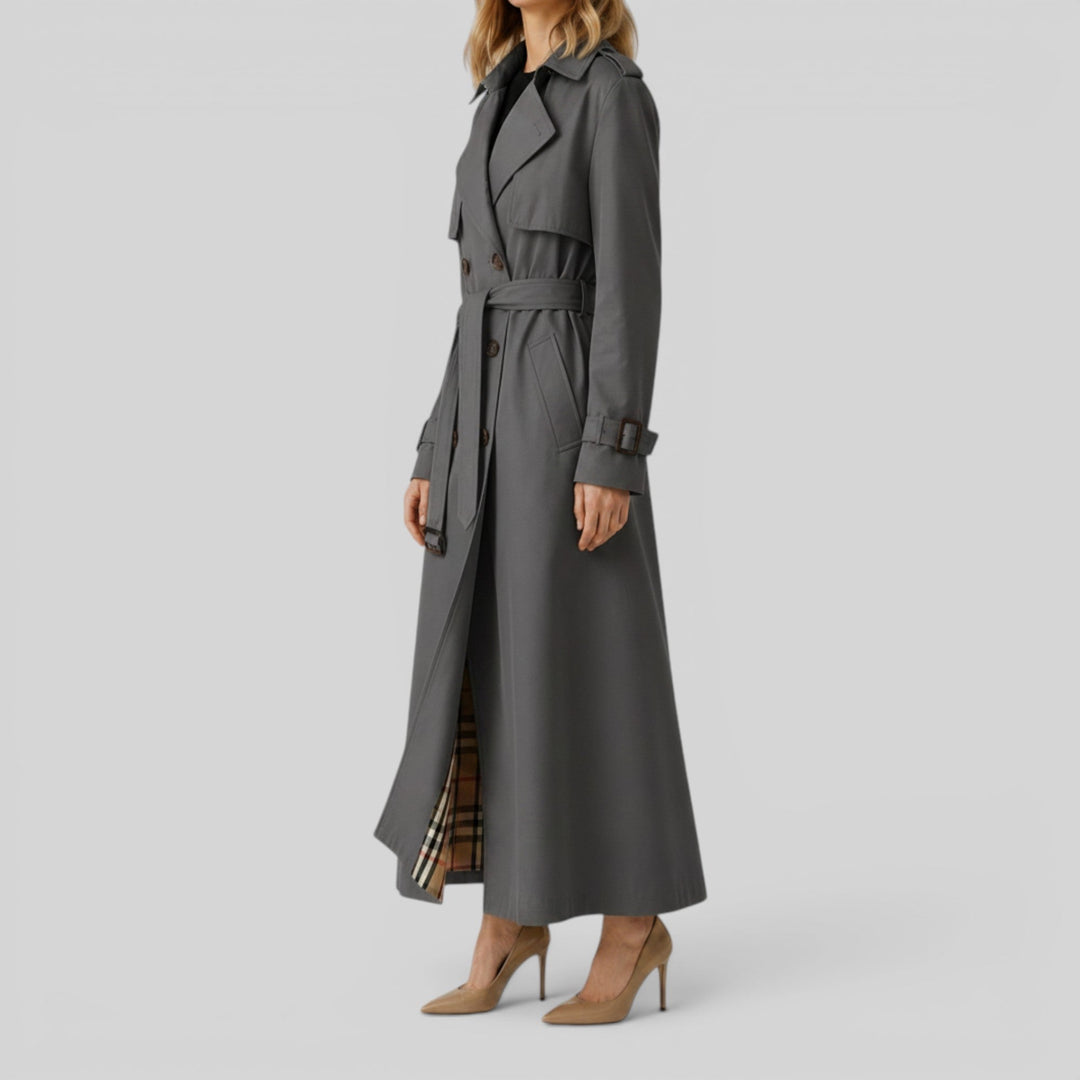 Detailed view of a women's classic longline trench coat, highlighting the belt and elegant silhouette.