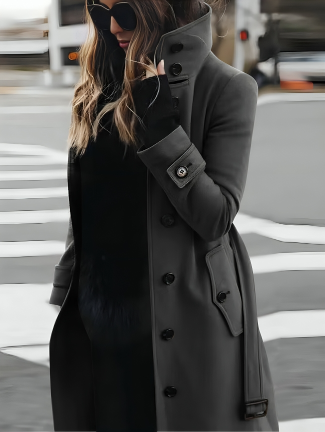 Classic women's belted trench coat. Elegant fall & winter outerwear with a high collar and long sleeves.