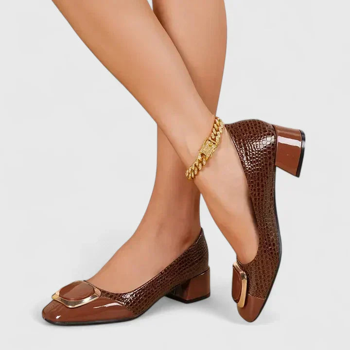Detailed view of a women's classic slip-on loafer, highlighting the comfortable block heel and design.