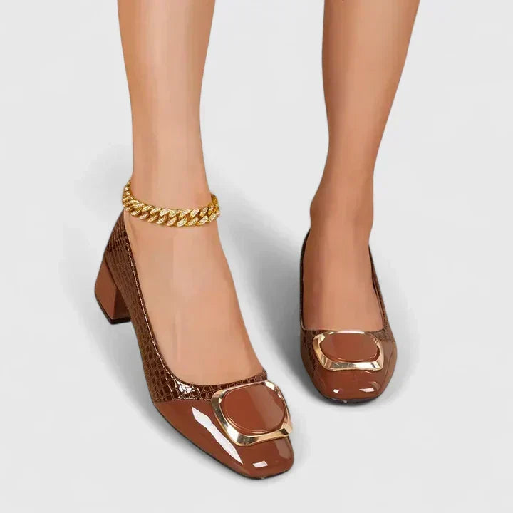 Woman wearing stylish block heel loafers, showcasing comfortable slip-on women's footwear for fashion.