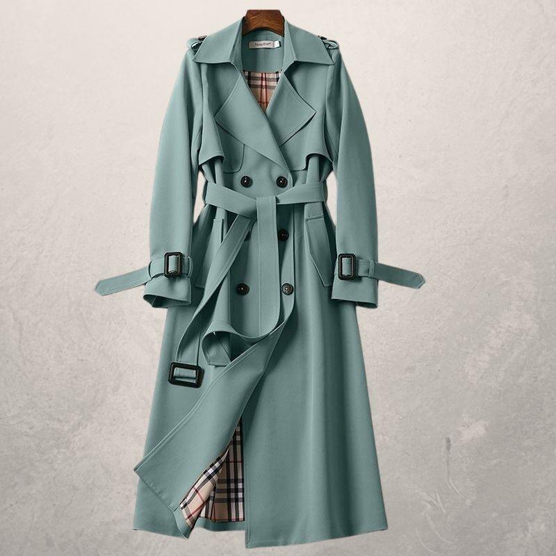 Front view of a women's classic double-breasted trench coat, belted, featuring button details and a wide collar.