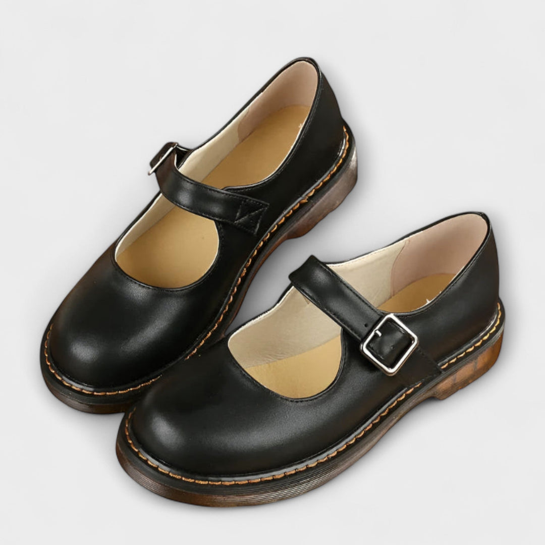 Women's classic Mary Jane flats with a secure buckle strap and comfortable round toe. Stylish for casual & work outfits.