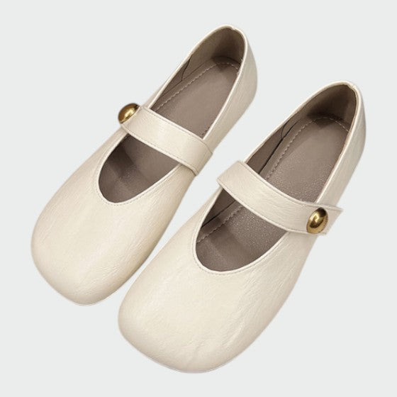 Elegant women's round-toe Mary Jane dress shoes with a secure button strap, ideal for everyday and special occasions.