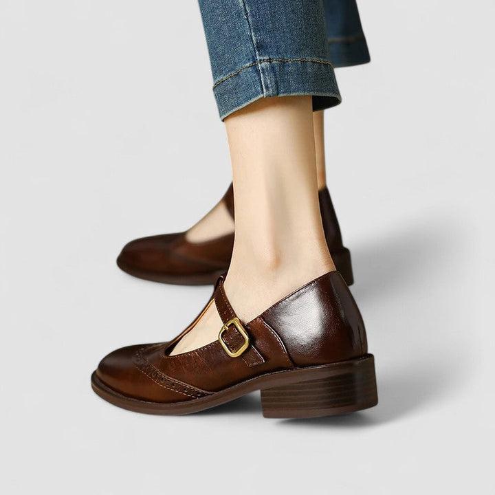 Elegant women's Mary Jane work shoes with secure instep strap. Classic style & comfortable for long office hours.