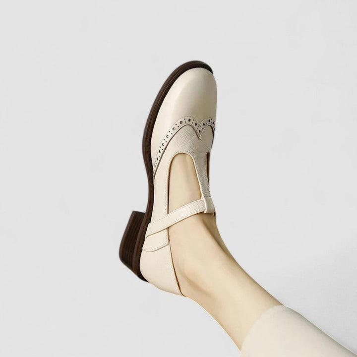 Beige women's classic Mary Jane shoes. Comfortable flats with secure instep strap & rounded toe for daily wear.