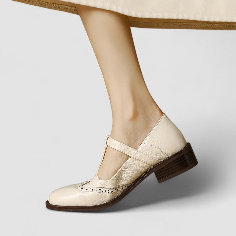 Chic beige Mary Jane flats for women. Features a classic rounded toe & secure instep strap, perfect for work or everyday.