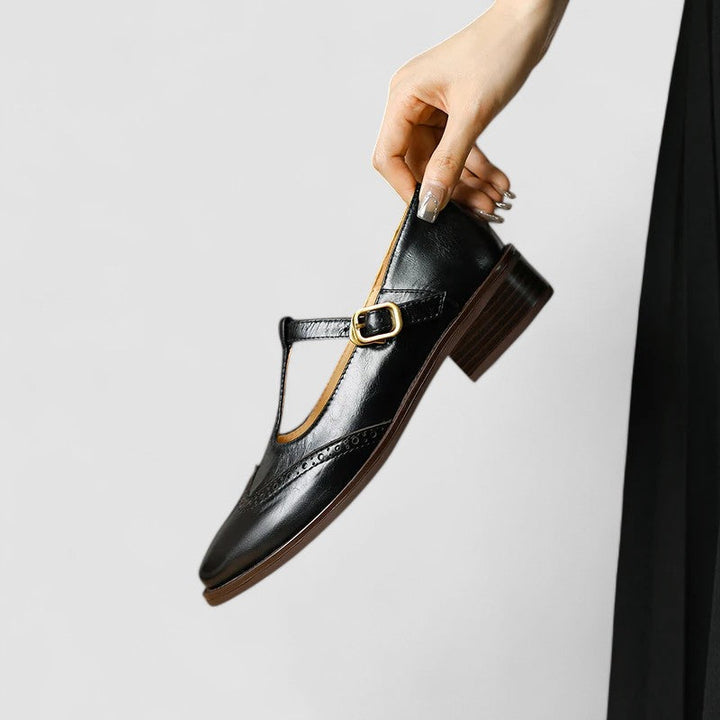 Black women's classic Mary Jane shoes. Comfortable flats with secure instep strap & rounded toe for daily wear.
