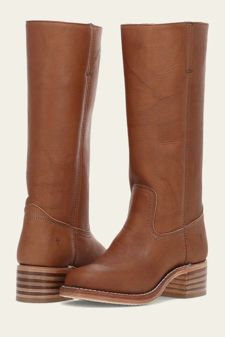Stylish women's cowboy boots with intricate stitching, ideal for festival or boho chic outfits.