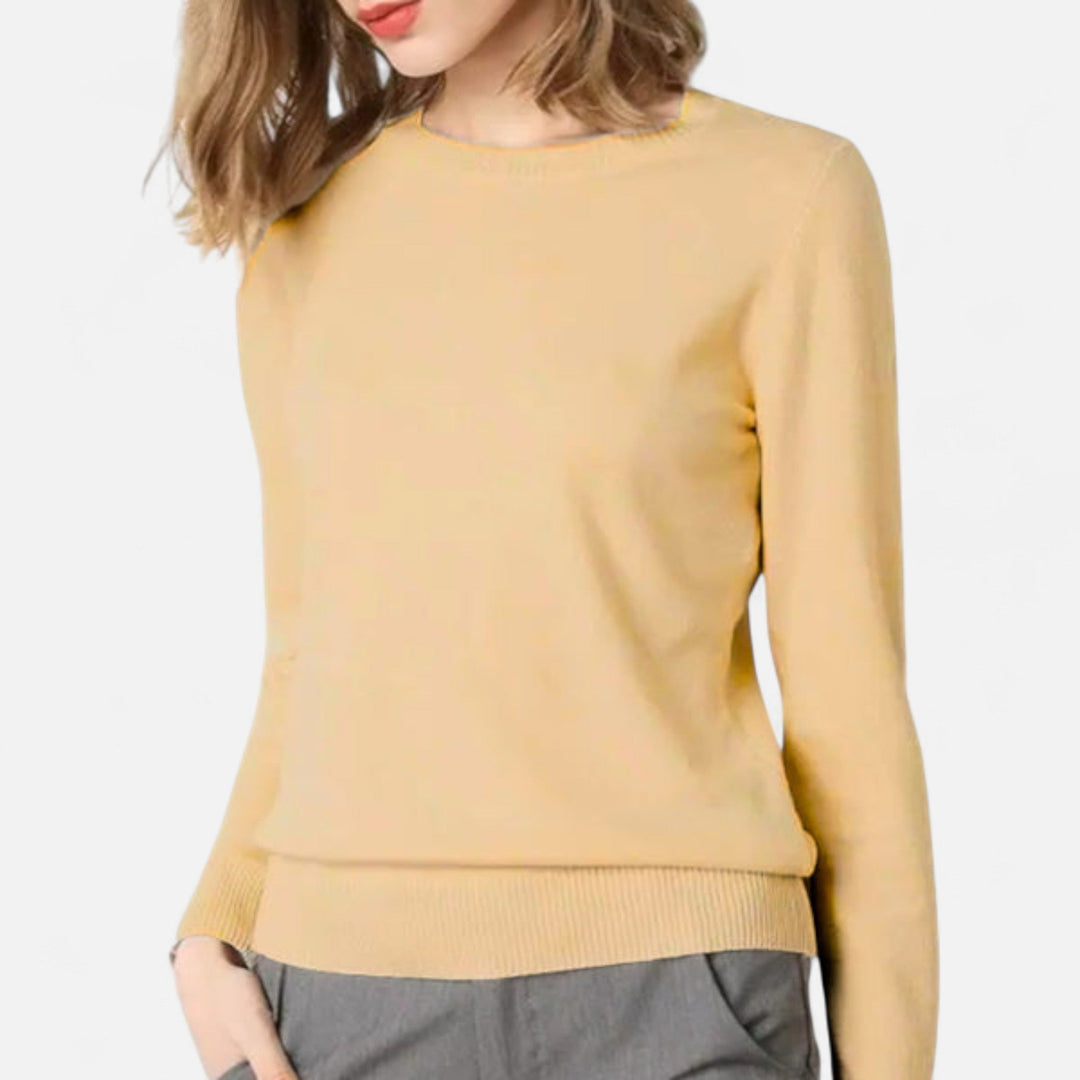 Essential womens wardrobe staple: a timeless round-neck sweater for comfortable, elegant style.