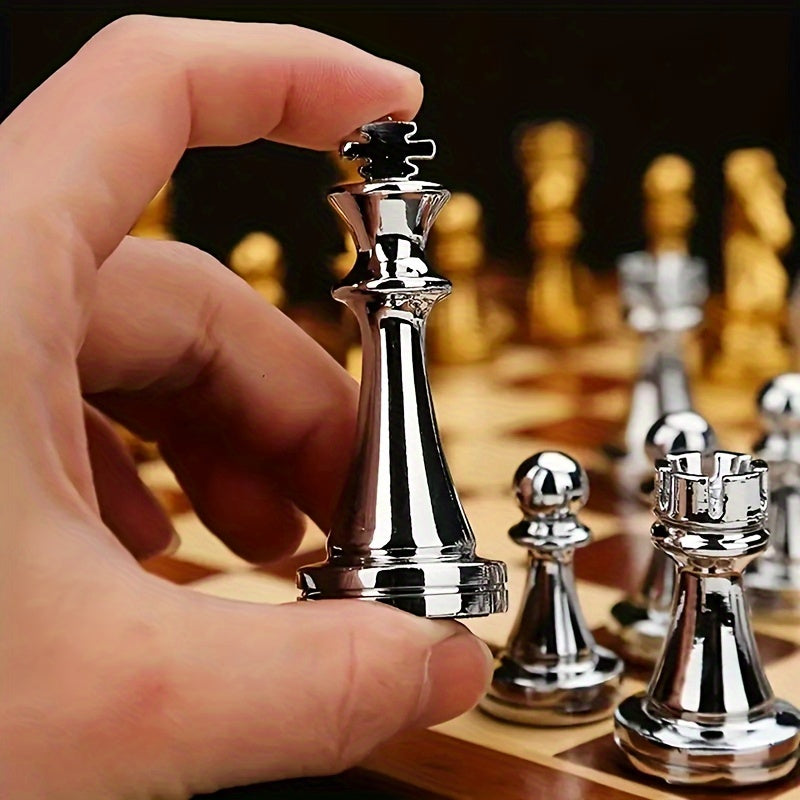 Wooden chess board with metal pieces, folds for easy travel and storage.