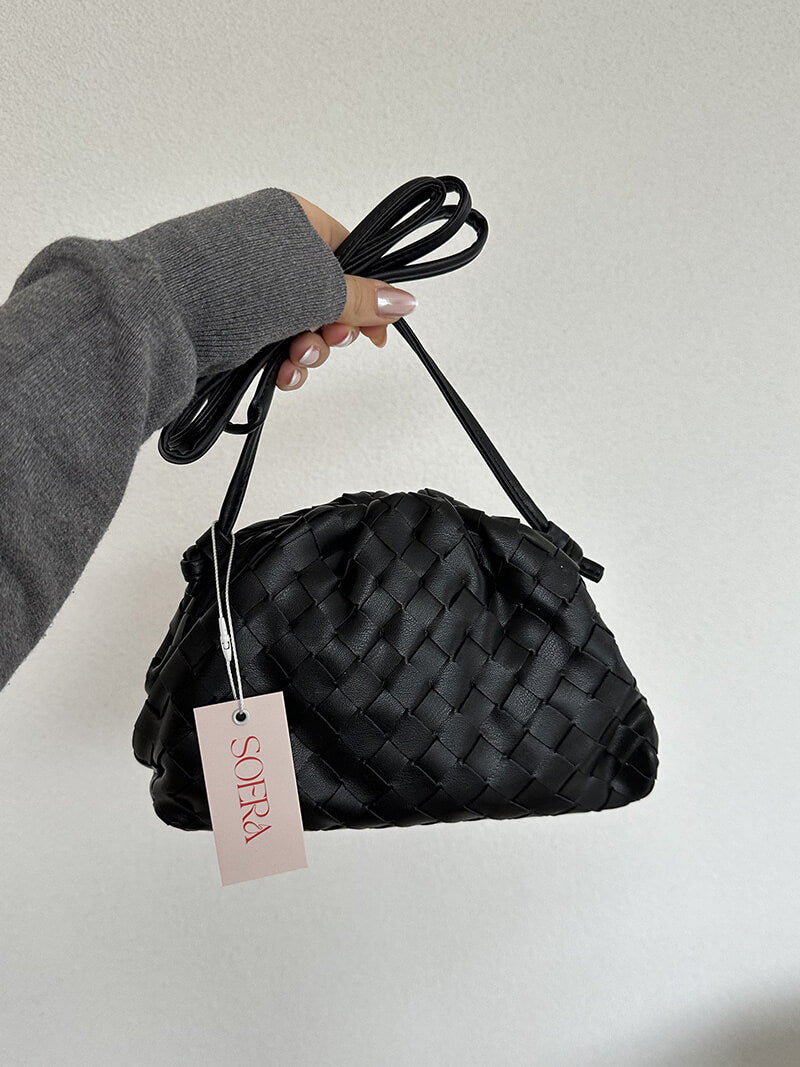 Delicate woven shoulder bag for women, a minimalist yet sophisticated accessory for a refined look.