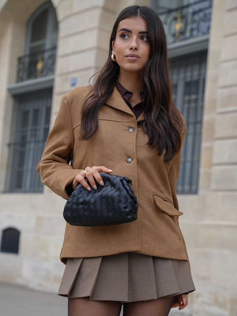 Front view of a beautiful women's woven shoulder bag, an elegant and versatile addition to your wardrobe.