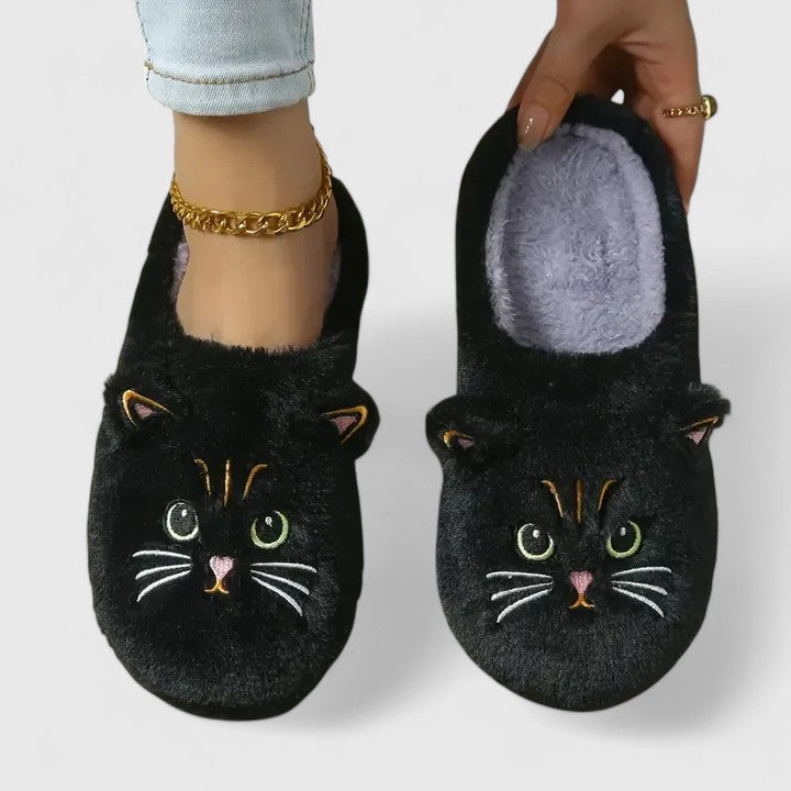 Close-up of soft pink women's cozy slippers with plush lining and non-slip sole, perfect for indoor comfort.