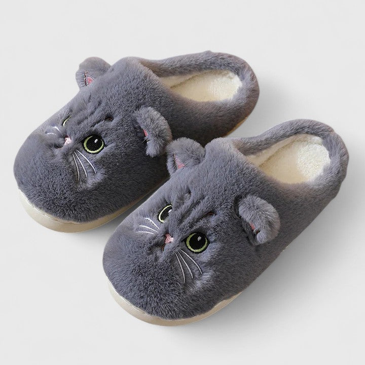 Pair of women's non-slip home slippers in a vibrant color, offering cozy foot comfort and warmth.