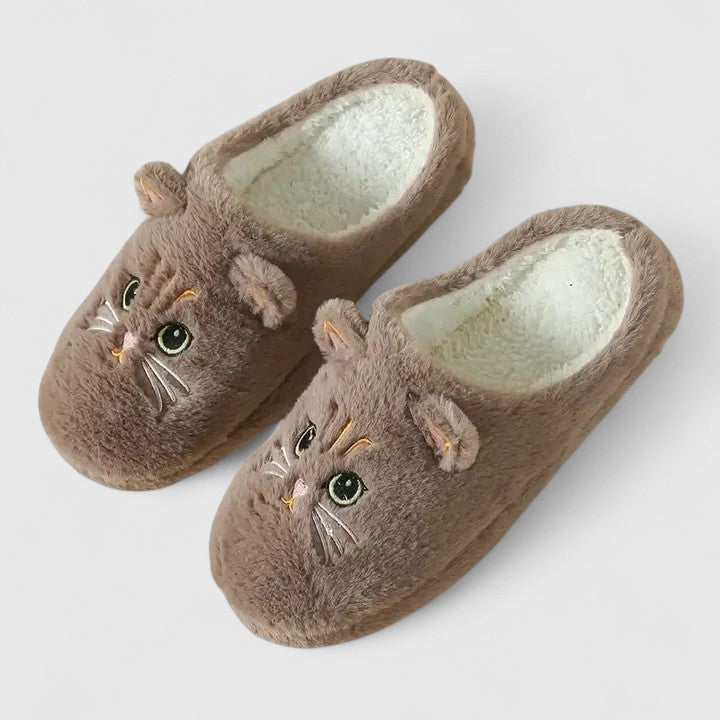 Women's comfortable home slippers, featuring arch support and a cozy plush interior for relaxation.