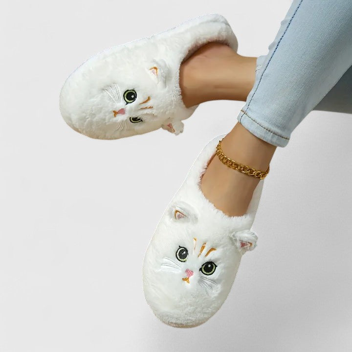 Front view of women's warm indoor slippers with a durable non-slip sole, ensuring safety and coziness.