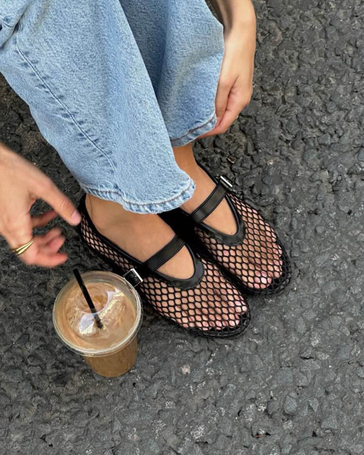 Close-up of Women's Elegant Black Mesh Ballet Flats with Secure Strap, comfortable everyday shoes.