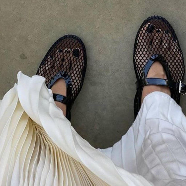 Comfortable Black Mesh Ballet Flats with secure strap, essential elegant women's everyday shoes.