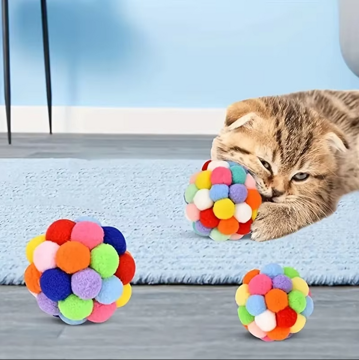 Textured pompom cat ball, a durable & interactive pet toy for stimulating active play in cats & kittens.