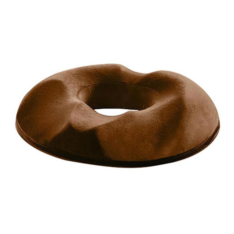 Donut-shaped cushion offering targeted support for tailbone.