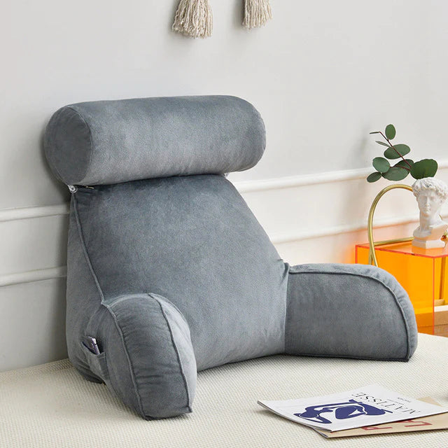 Comfortable bedrest pillow with supportive arms for reading and lounging