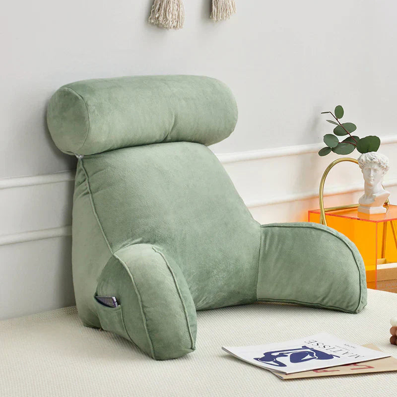 Supportive reading pillow with arms, perfect for extended lounging and relaxation