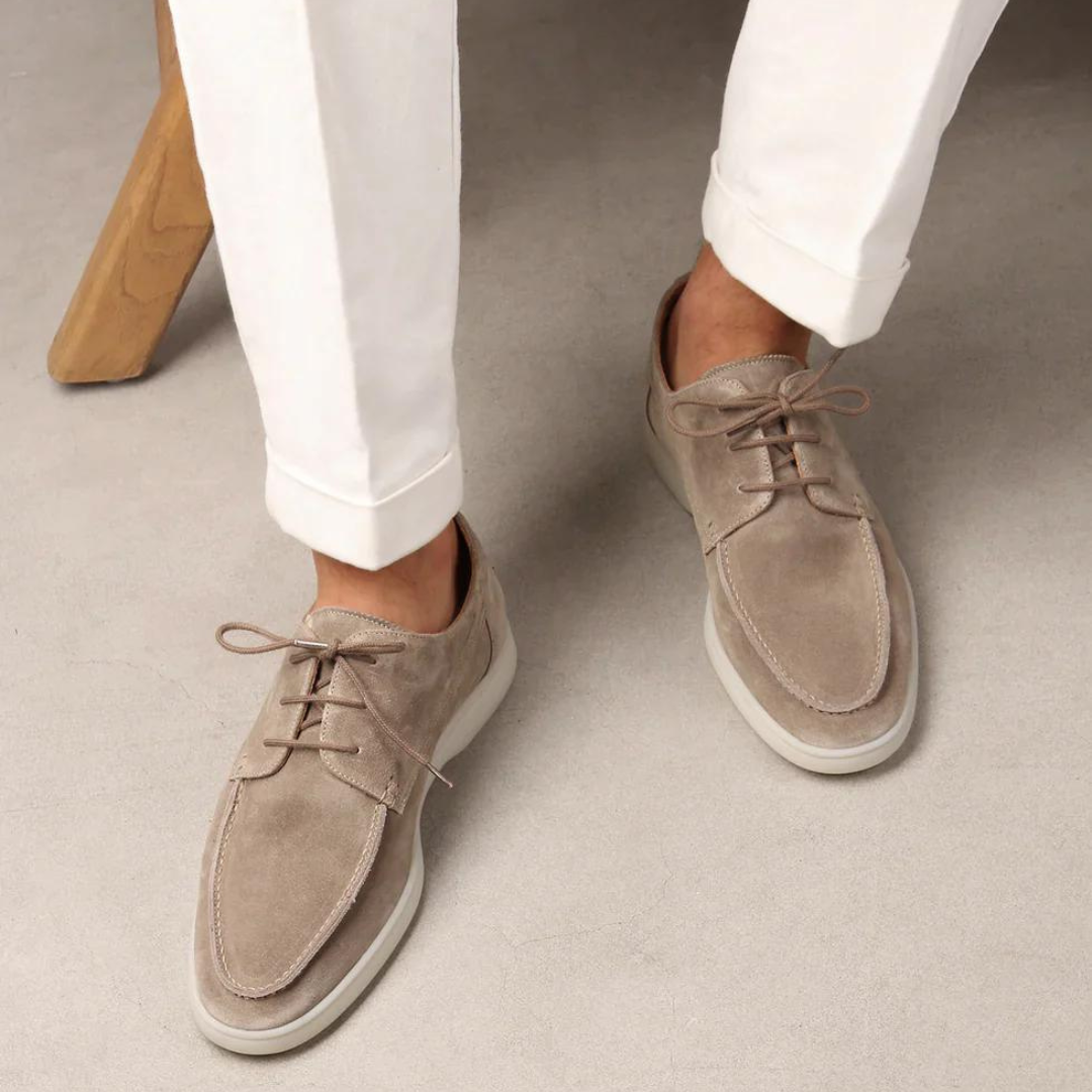 Stylish beige suede men's casual sneakers with a relaxed fit, perfect for comfortable everyday walking.