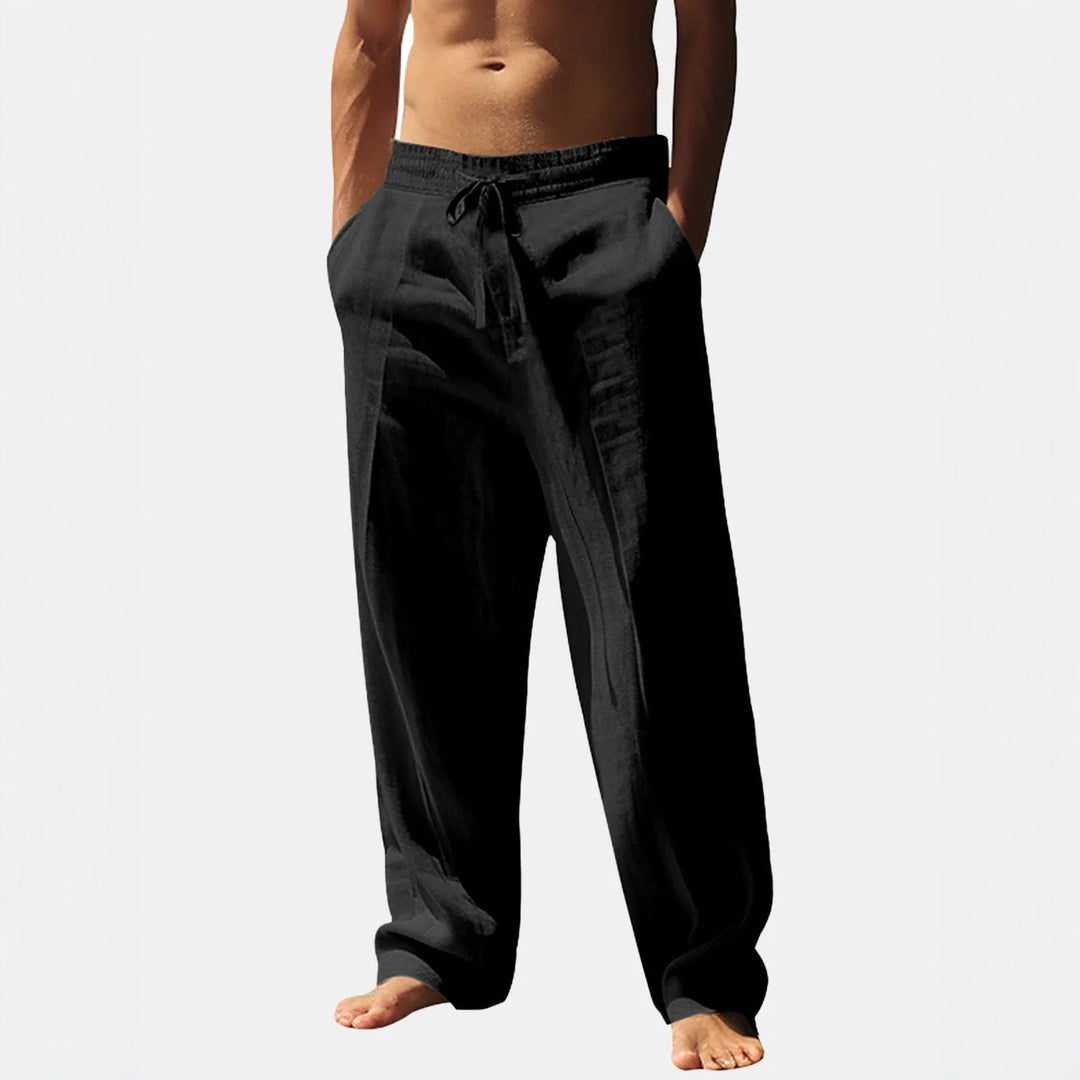 Relaxed fit men's summer trousers. Lightweight fabric, elastic waist & practical pockets for holidays.