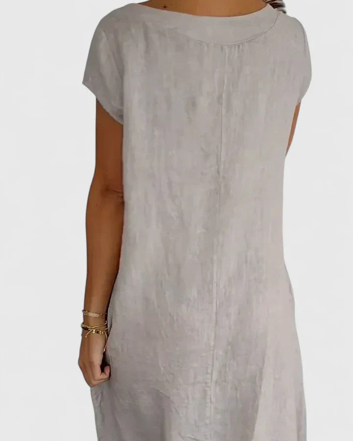 Soft women's A-line summer dress with short sleeves and pockets, designed for all-day comfort.