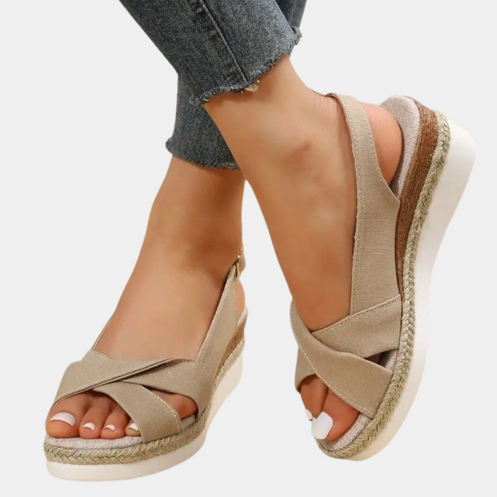 Close-up of comfortable women's espadrille flats with woven jute sole, showing textile upper. Casual summer shoes.