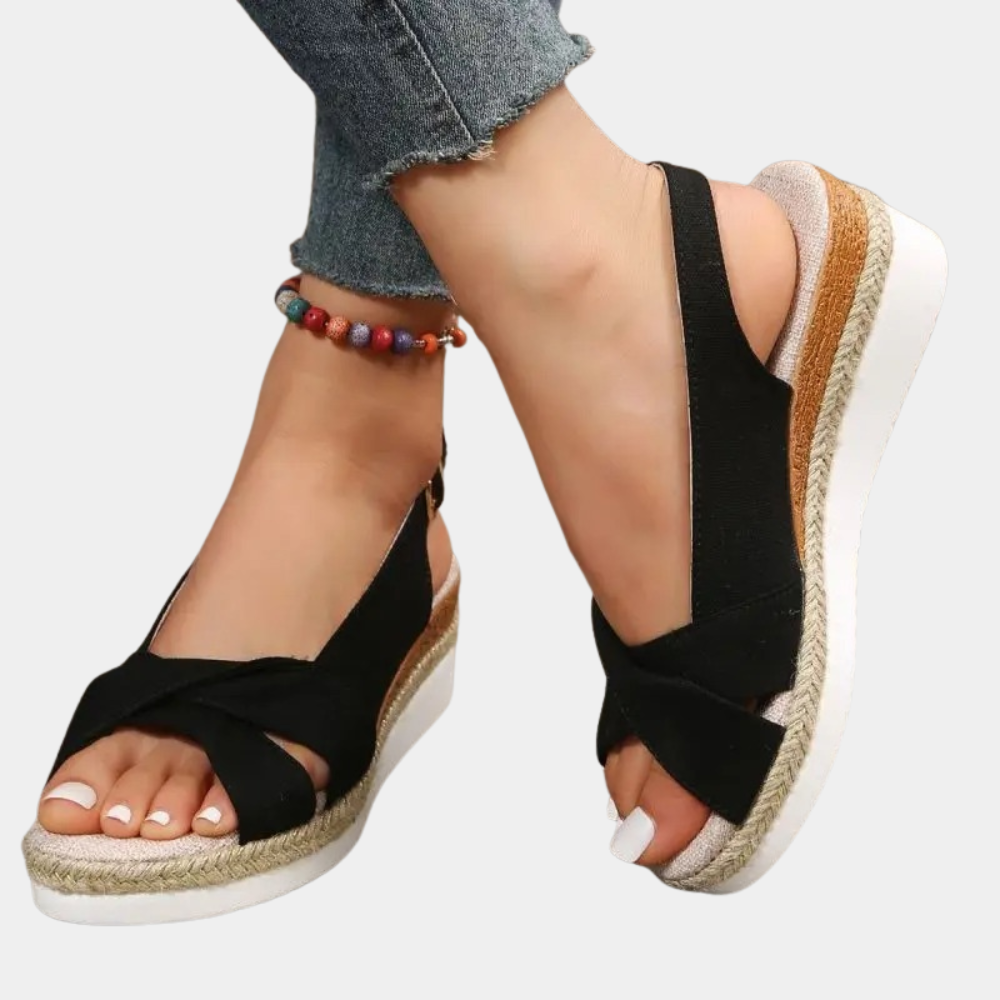Woman wearing comfortable espadrille flats, perfect for versatile summer style. Lightweight and casual slip-on footwear.