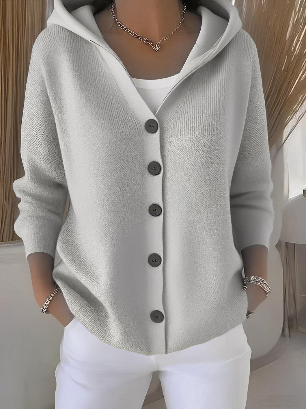 Women's casual hooded sweater cardigan with buttons, great for layering in fall, winter, or spring outerwear.