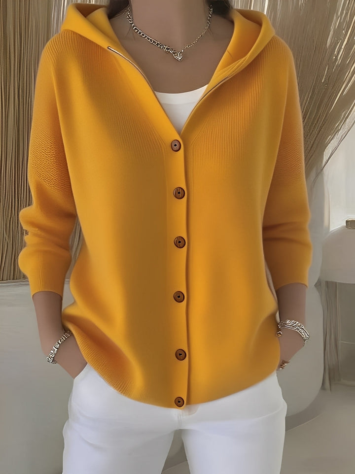 Soft women's long-sleeve knitted cardigan with hood and practical button front for ultimate comfort.