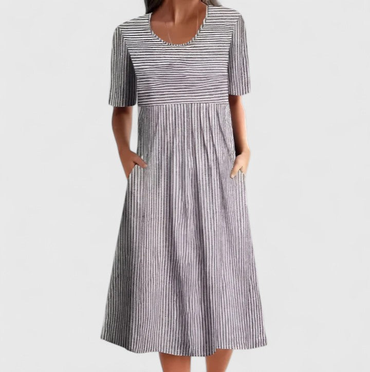 Elegant women's striped midi dress with button details, available in blue or grey. Versatile for day or summer events.