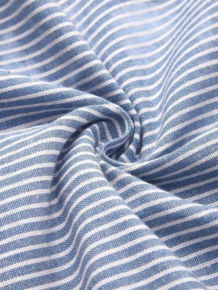 Stylish women's summer midi dress featuring soft striped fabric, ideal for casual wear or an elegant day outing.