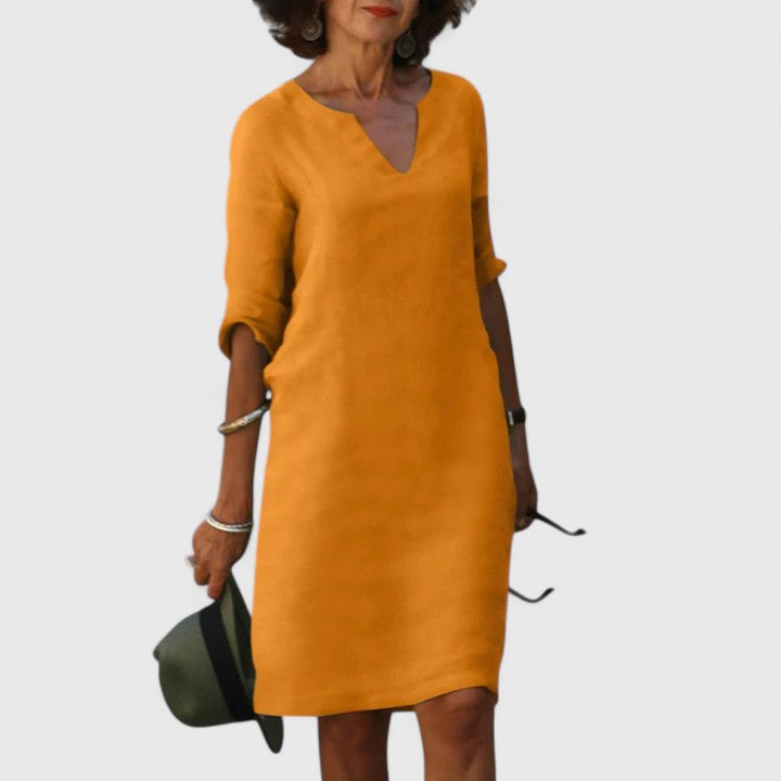 Versatile V-neck dress for women, ideal for casual everyday wear or chic summer occasions. Effortless style.