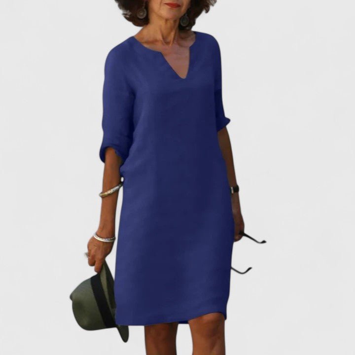 Lightweight women's V-neck summer dress, comfortable and chic for warm weather. Easy-care fashion.