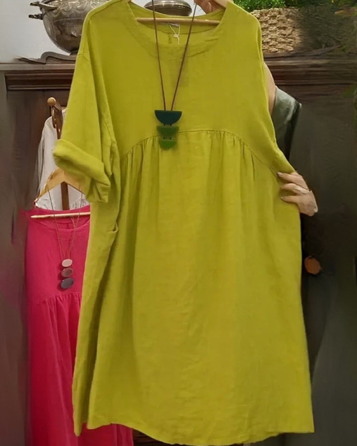 Women's knee-length flowy midi dress for all-day comfort. Wide, relaxed fit ideal for casual summer style.