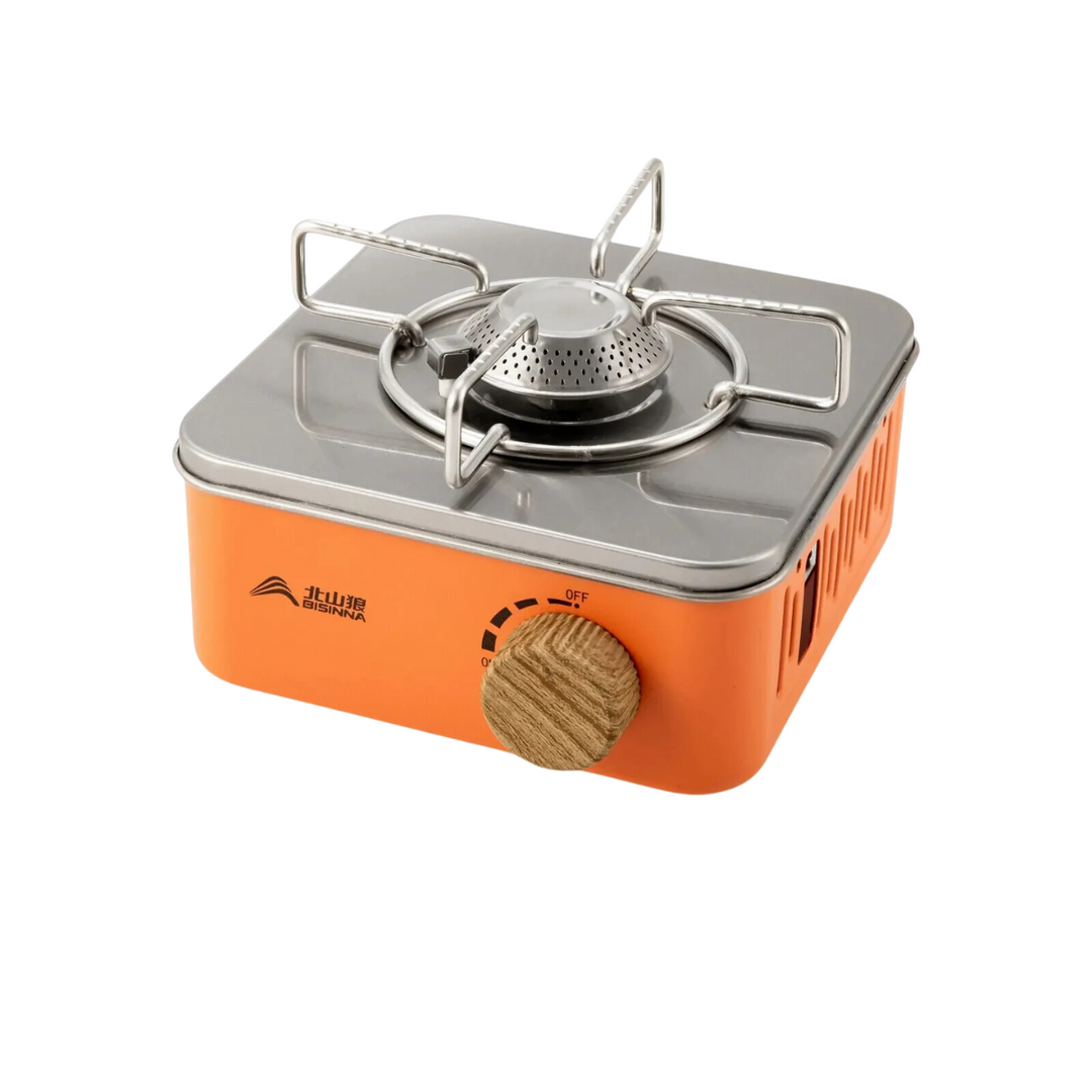 Portable gas camping stove set up for outdoor cooking, high power burner ready for adventure meals.