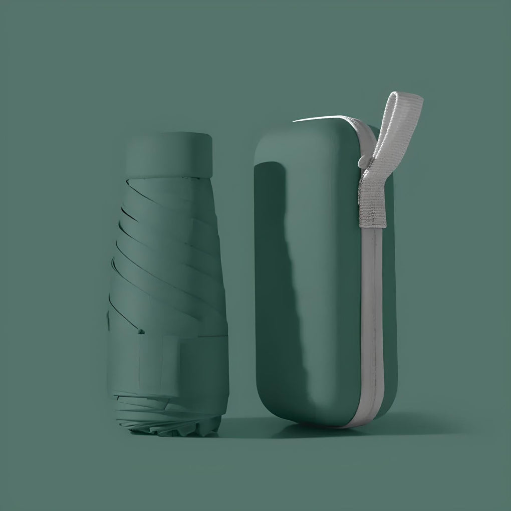 Portable umbrella for travel, offering sun protection and rain gear.