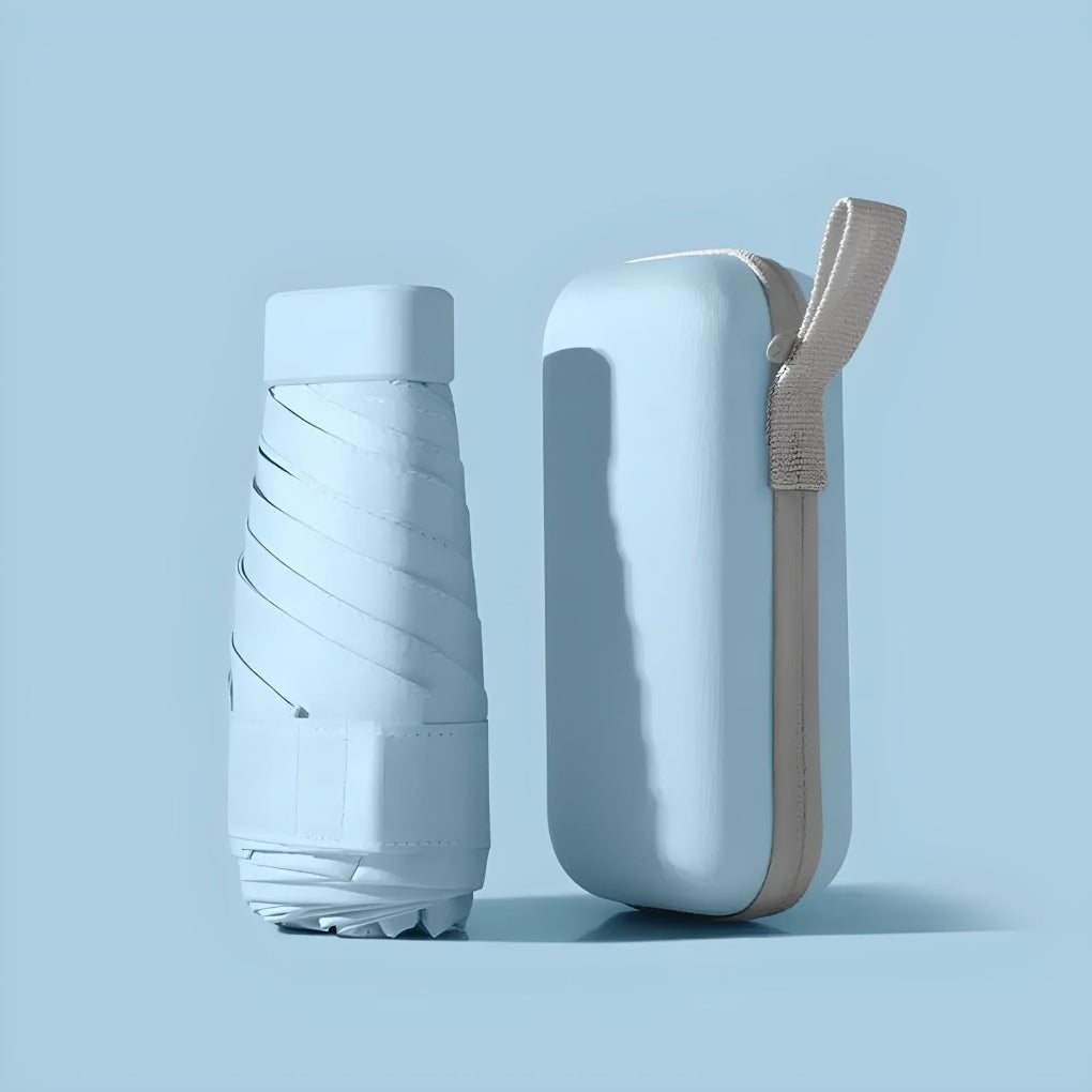 Compact umbrella designed for travel, perfect for sun or rain protection.