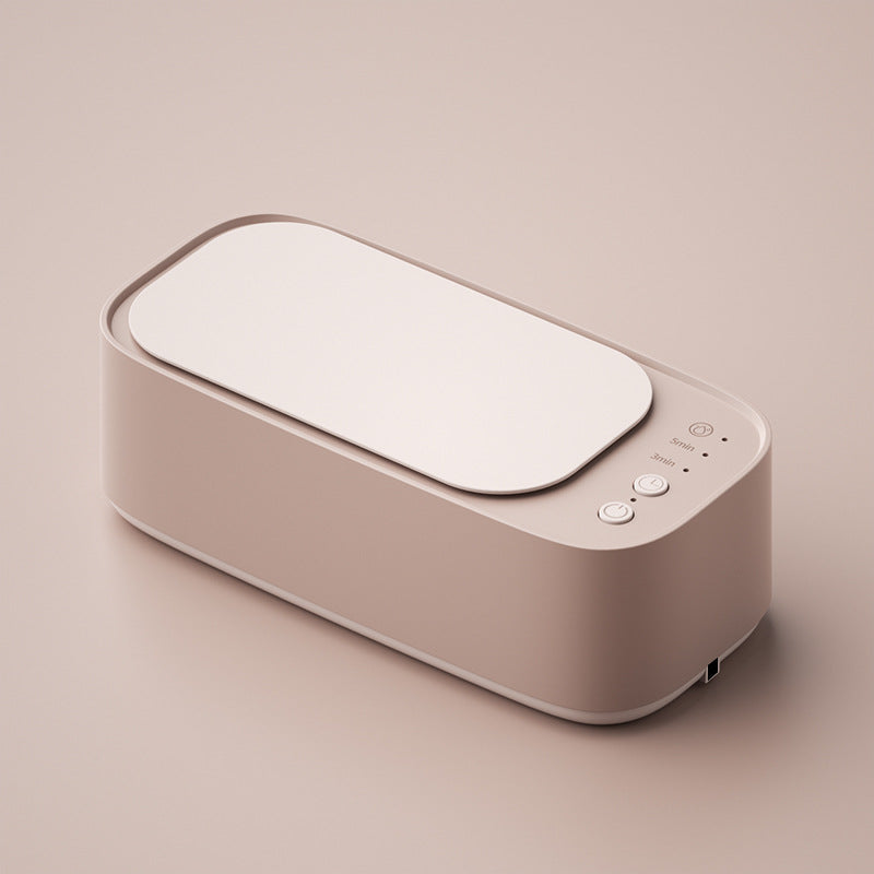 Compact ultrasonic cleaner sparkling a diamond ring. Perfect for delicate jewelry, watches & glasses.