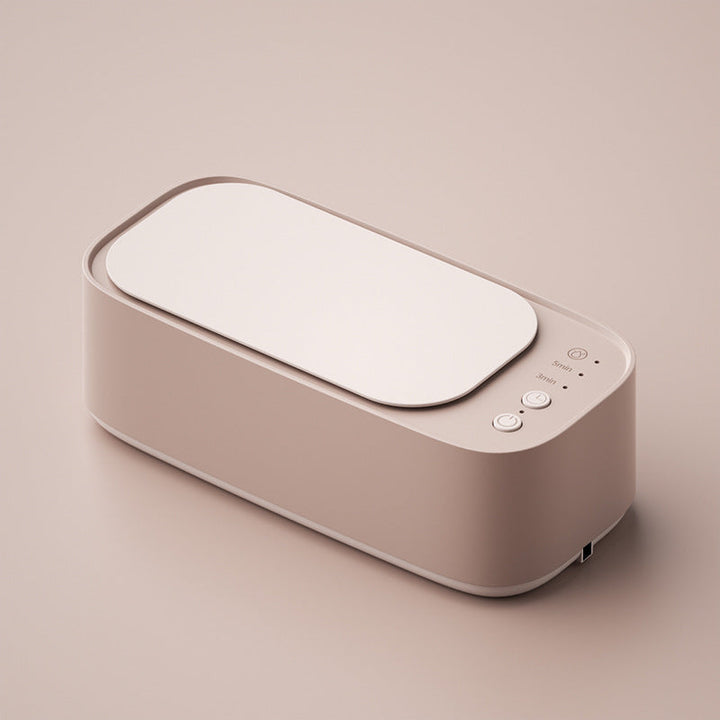 Compact ultrasonic cleaner sparkling a diamond ring. Perfect for delicate jewelry, watches & glasses.