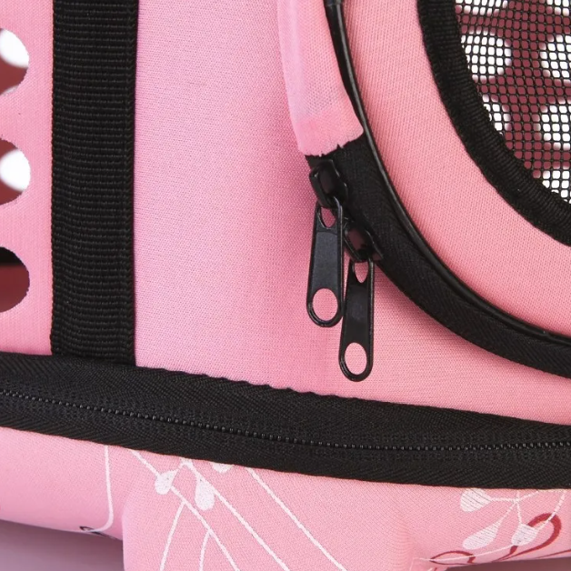 Compact ventilated cat carrier, offering a secure and comfortable space for your pet.
