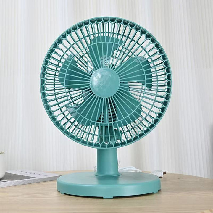 Small white table fan with adjustable speed, perfect for a desk or home office cooling.