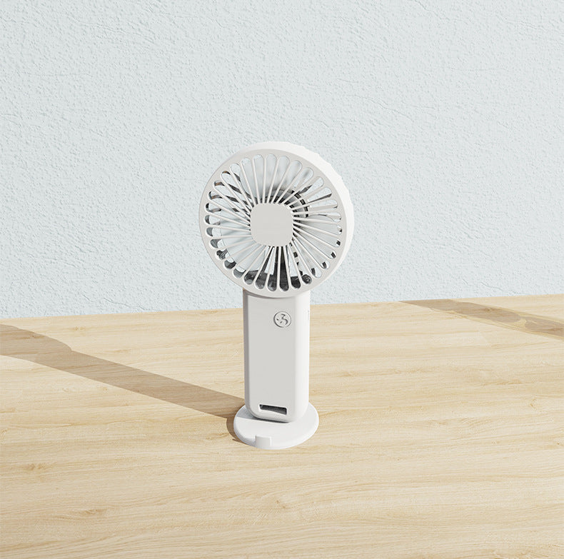 Portable travel fan, rechargeable & compact, perfect for staying cool on-the-go this summer.