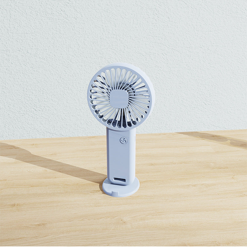 White unisex personal fan, rechargeable and portable, ideal for individual cooling needs.